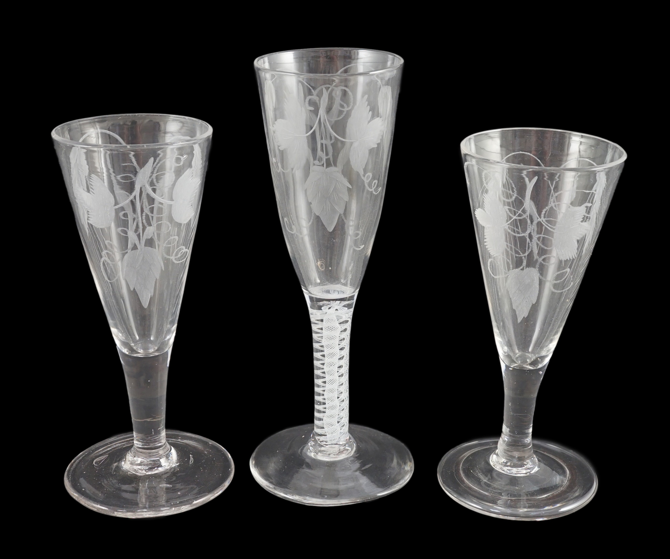 Three ‘hops and barley’ wheel engraved glass ale flutes, mid 18th century